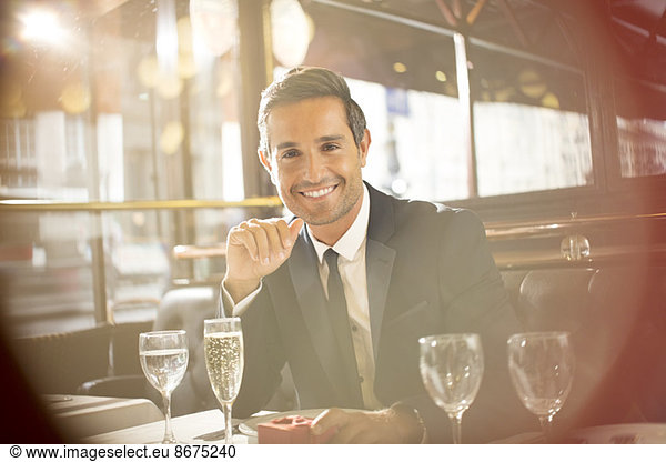 Businessman smiling at restaurant