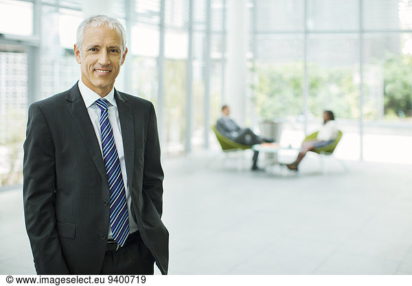 Businessman smiling in office building