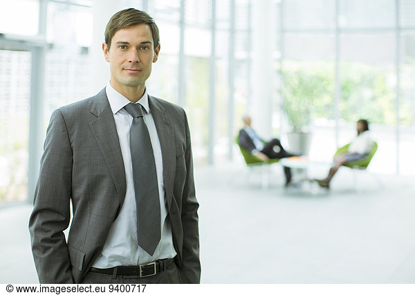 Businessman standing in office building