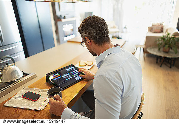 Businessman using digital tablet  working from home