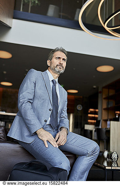 Businessman waiting in hotel lobby