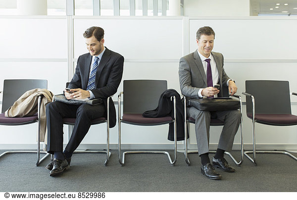 Businessmen sitting in waiting area