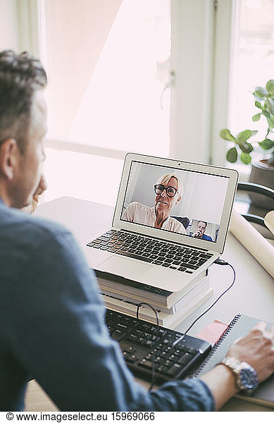 Businesspeople having a video call working at home