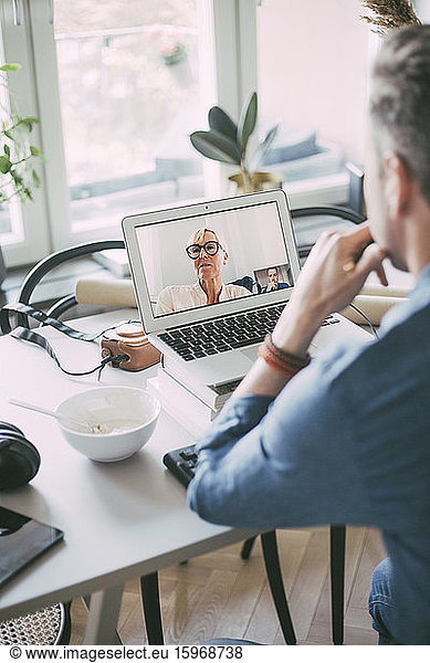 Businesspeople having video conference call working at home