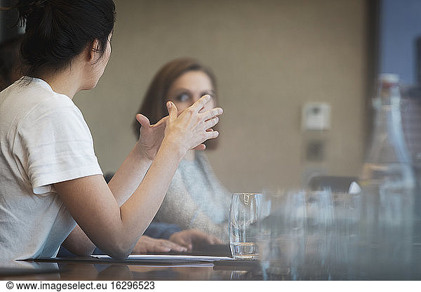 Businesswoman explaining in conference room meeting