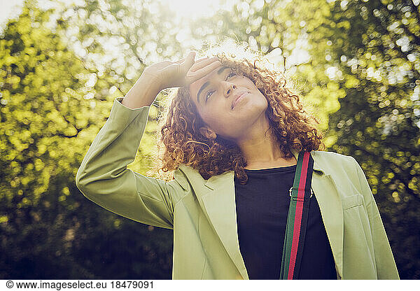 Businesswoman gesturing wearing green blazer