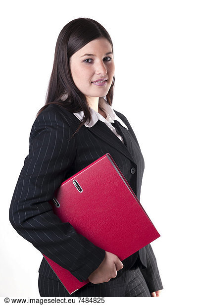 Businesswoman holding a red folder in her arm  looking friendly