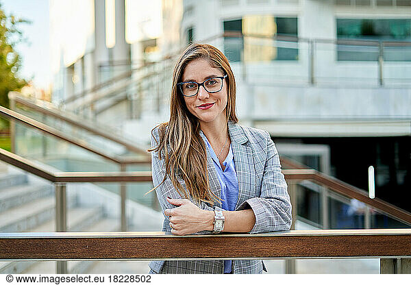 businesswoman in front of office building