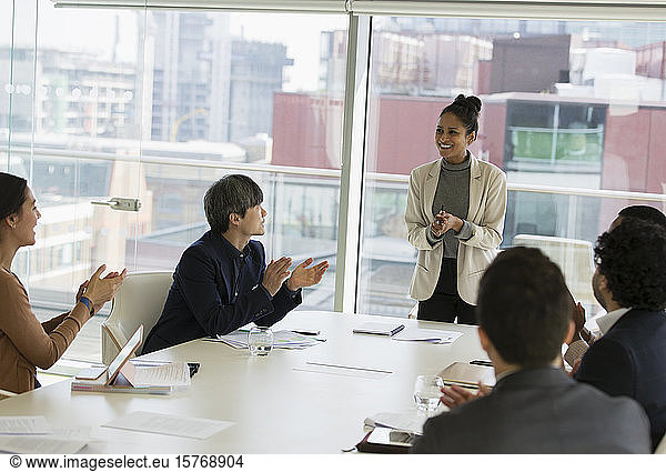 Businesswoman leading conference room meeting