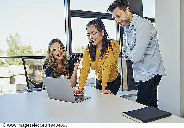 Businesswoman planning strategy with colleagues in office
