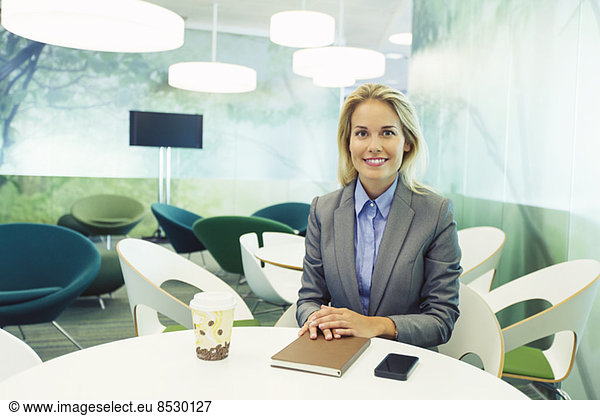 Businesswoman smiling in cafe