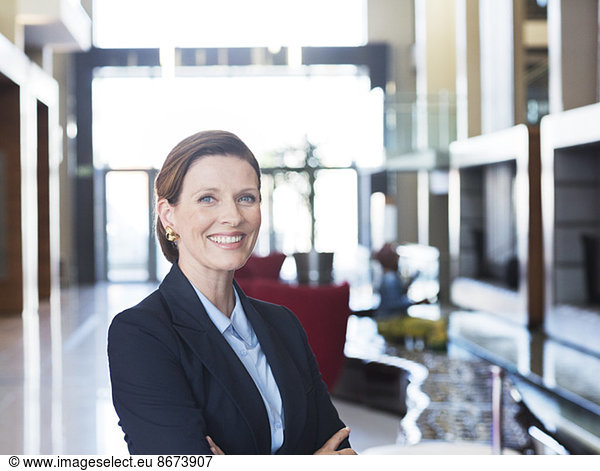 Businesswoman smiling in lobby