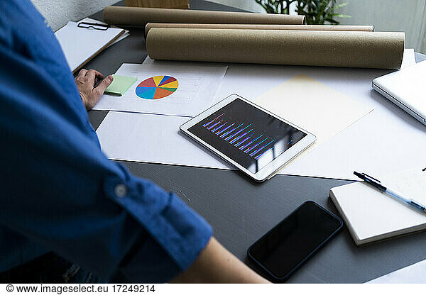 Businesswoman with digital tablet at office