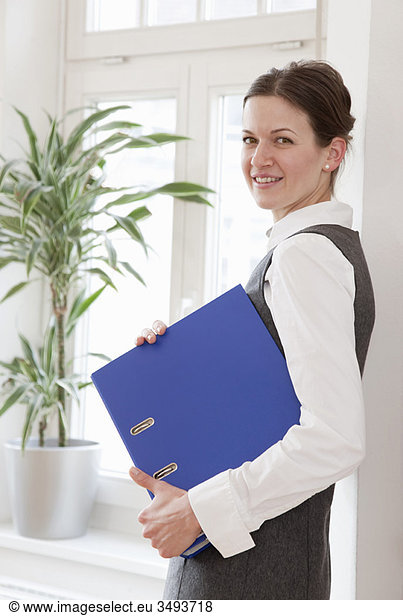 Businesswoman with file folder