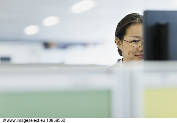 Businesswoman working at computer in office