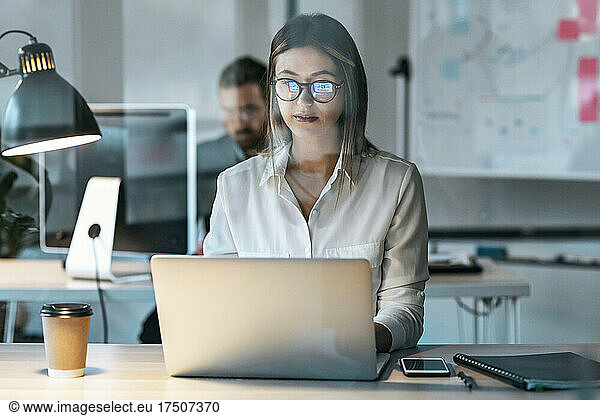 Businesswoman working on laptop in office