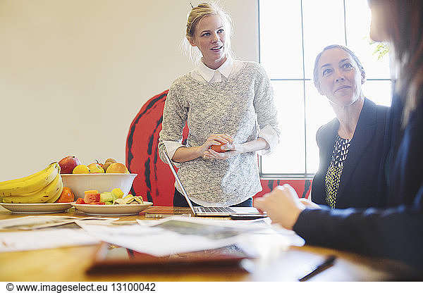 Businesswomen discussing at table in office