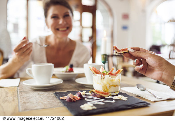 Businesswomen eating dessert in restaurant