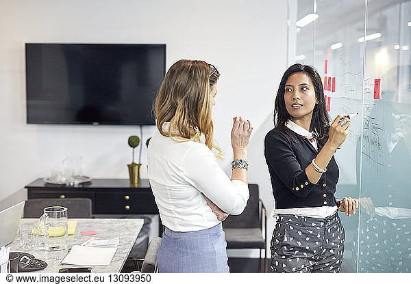 Businesswomen having discussion during meeting in office