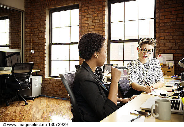 Businesswomen planning while working in office