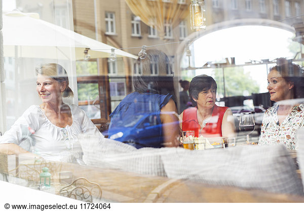 Businesswomen talking during lunch in restaurant
