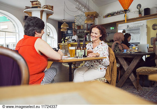 Businesswomen talking during lunch in restaurant