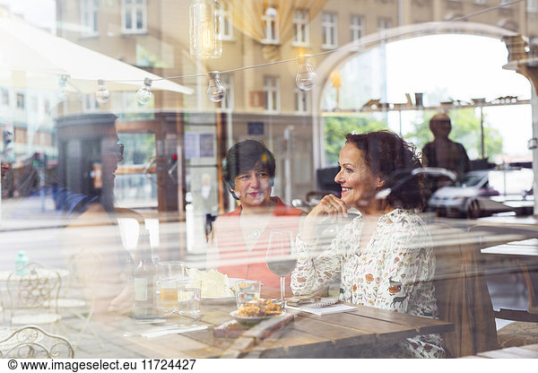 Businesswomen talking during lunch in restaurant