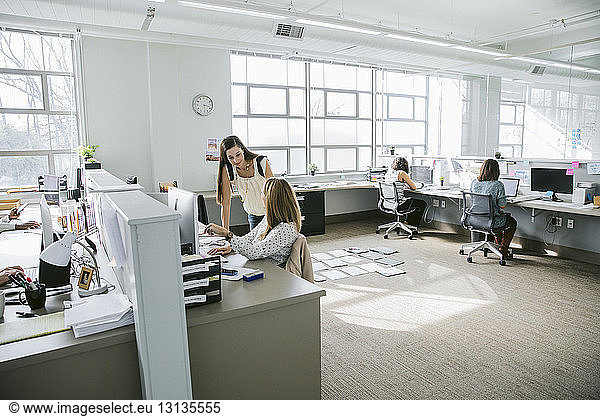 Businesswomen working at desks in office