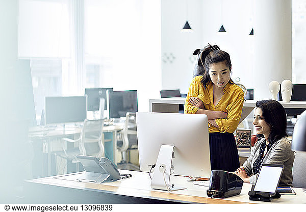 Businesswomen working on desktop computer in office