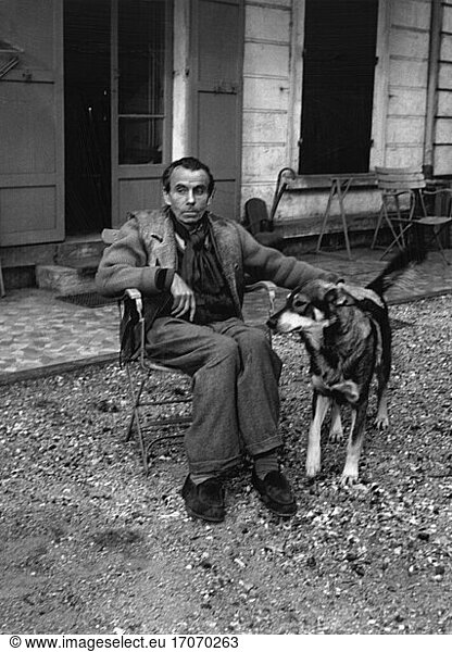 Céline  Louis-Ferdinand
(real name Destouches  Louis-Ferdinand)  French doctor and writer.
Courbevoie 27.5.1894 – Meudon 1.7.1961. Céline  with dog  in front of his house in Meudon. Photo  1952.