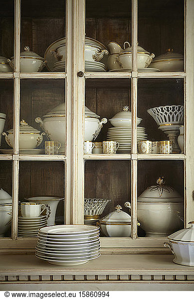 Cabinet filled with Bavarian white and gold china collection