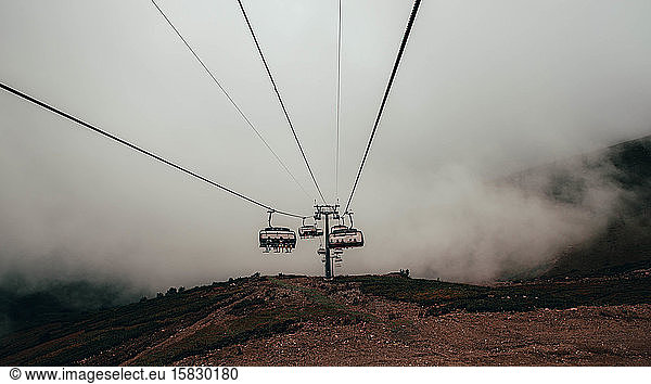 Cable car in the foggy forest