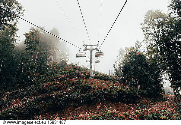 Cable car in the foggy forest