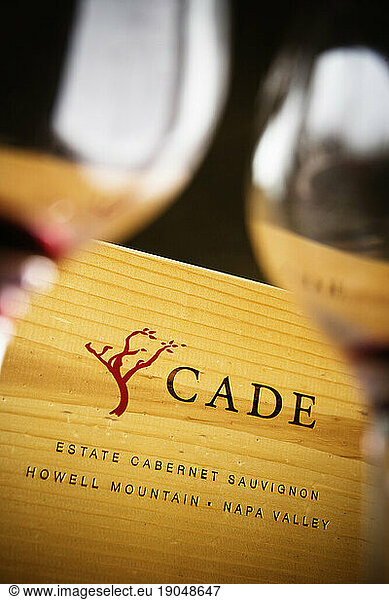 Cade Winery wooden box and empty wine glasses.
