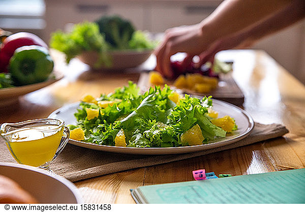 Caesar salad with copyspace on a wooden table on kitchen