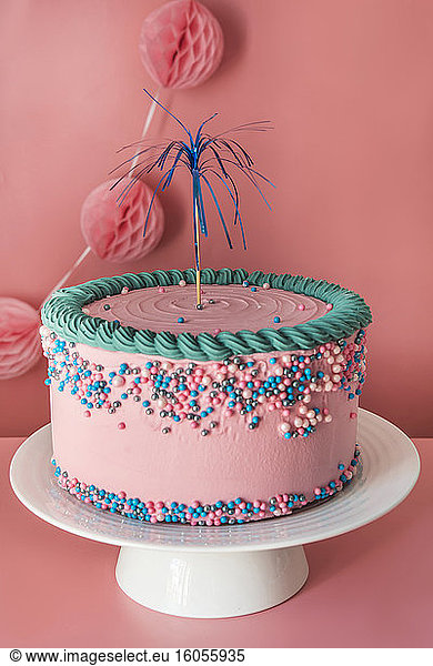Cake stand with strawberry birthday cake