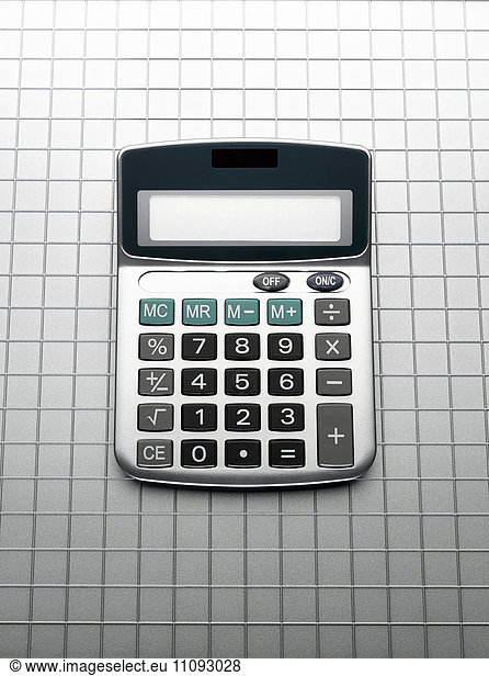 Calculator on grid gray background