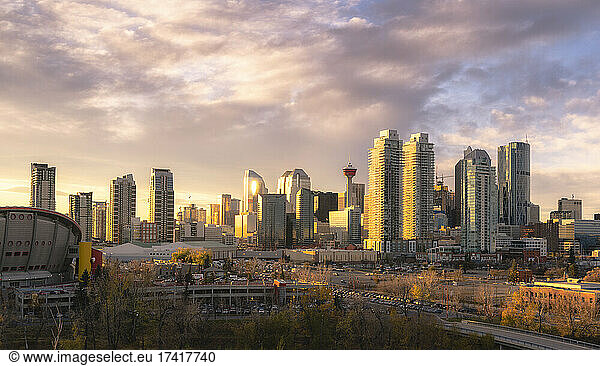 Calgary cityscape lit up at dawn.