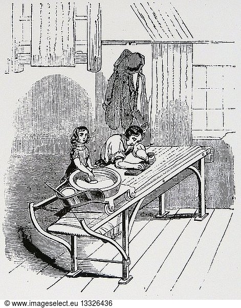 Calico printing by hand blocks: Each man had a boy or girl assistant who spread colour on elastic drum on which printer pressed his block to recharge it. Engraving  London  1843.