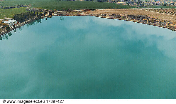 Calm turquoise lake seen from above