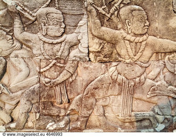 Cambodia - Bas-relief with battle scenes in the Bayon  a temple in the centre of Angkor Thom  the Â¥Great CapitalÂ¥ of the Khmer empire in Angkor The temple complexes of Angkor Â¥cityÂ¥ were the heart of the Khmer empire which flourished from the 9th to the
