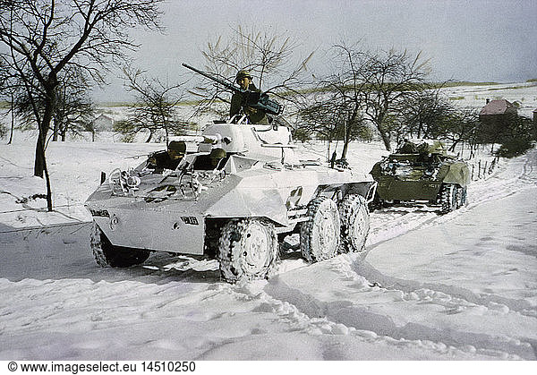 Camouflaged Light Armored Car M8 and one that was not Painted White  Ardennes-Alsace Campaign  Battle of the Bulge  1945