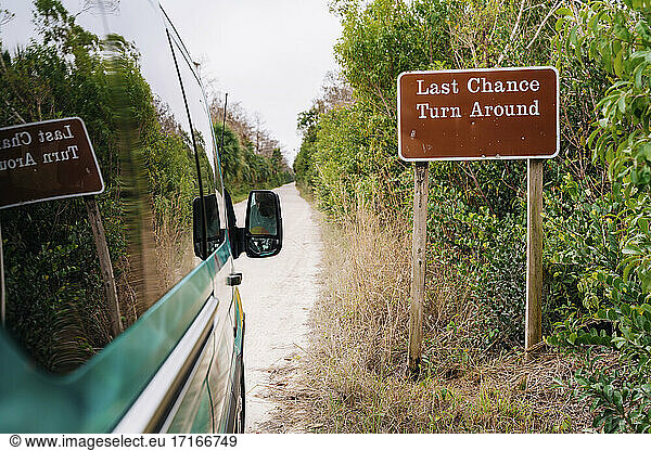 Campervan by signboard at Everglades National Park