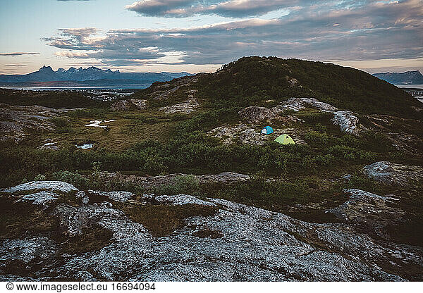 Camping tents set on a serene mountain landscape