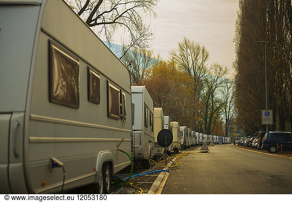 Camping Trailers Parked In A Row Along A Street With Electrical Lines And Hoses For Hook Up; Locarno  Ticino  Switzerland