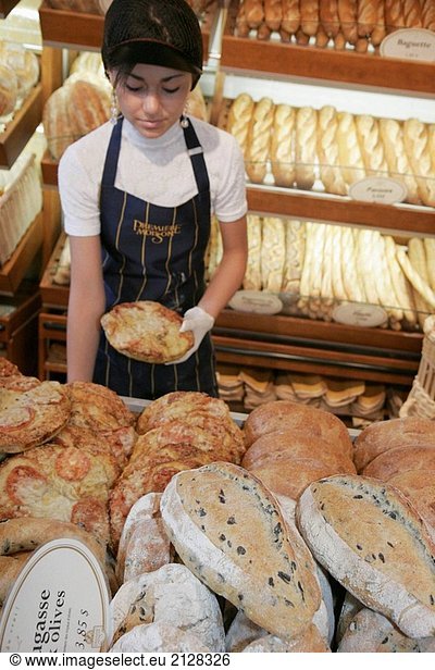 Canada  Montreal  Atwater Market  rue Saint_Ambroise  Boulangerie Premiere Moisson  bakery  bread display  female