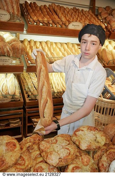 Canada  Montreal  Atwater Market  rue Saint_Ambroise  Boulangerie Premiere Moisson  bakery  bread  teen boy  loaf