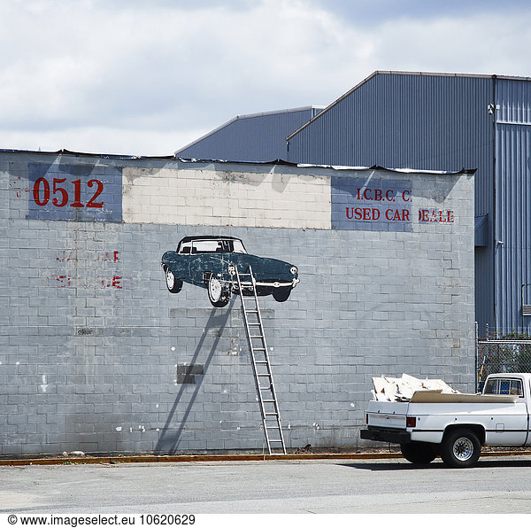 Canada  Vancouver  graffiti on industrial hall  car  ladder