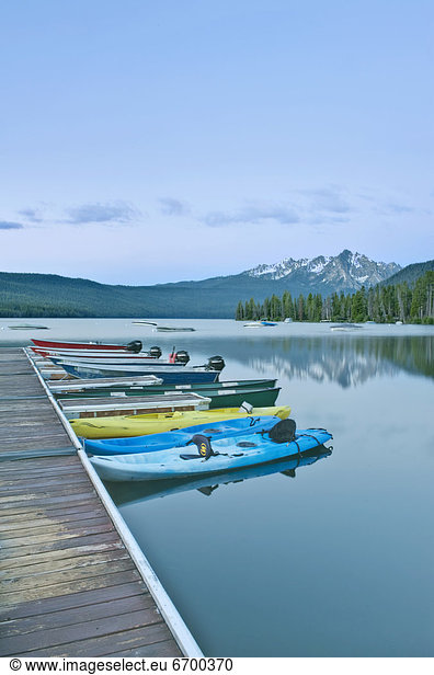 Canoes Docked on a Lake