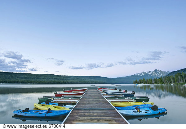 Canoes Docked on a Lake